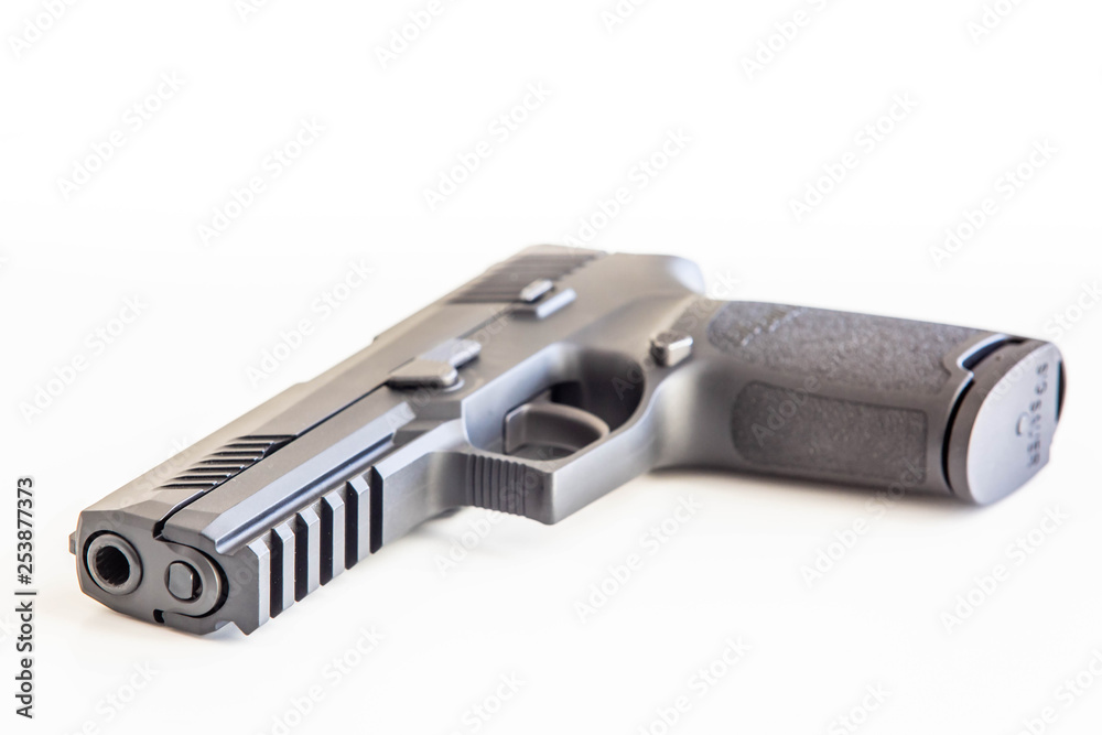 Modern handgun white background isolated close up Modern handgun white background isolated close up