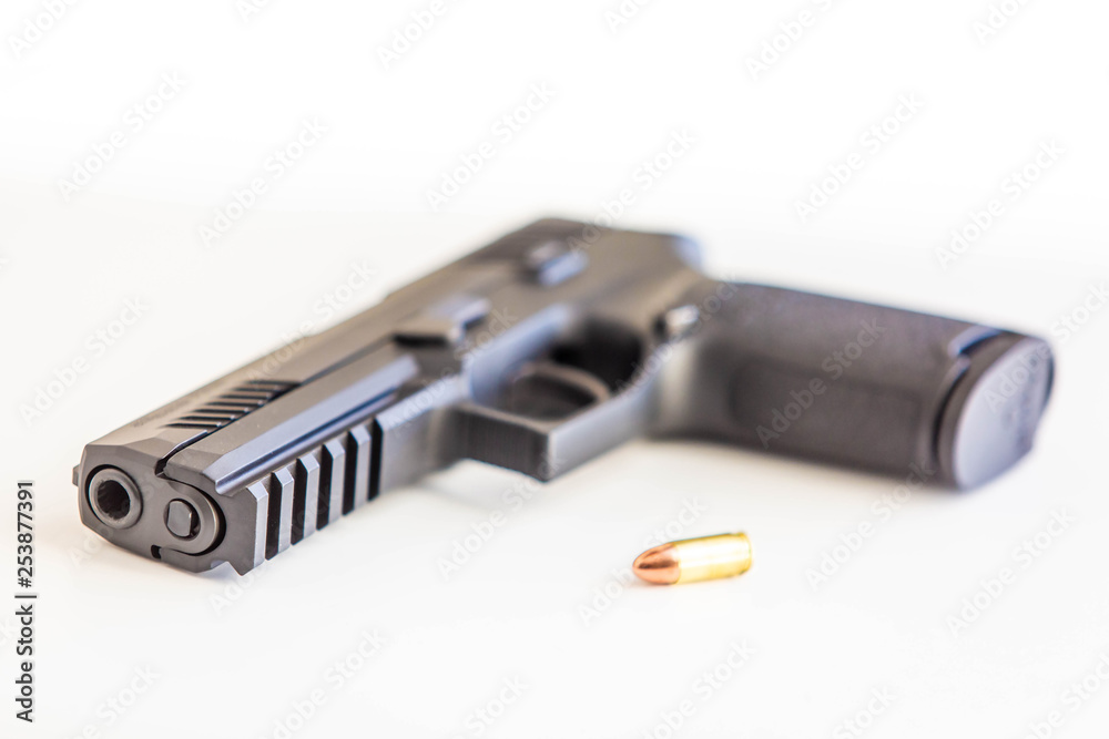 Modern handgun white background isolated close up Modern handgun white background isolated close up