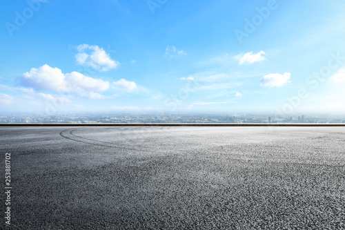 Empty asphalt road ground over modern city © ABCDstock
