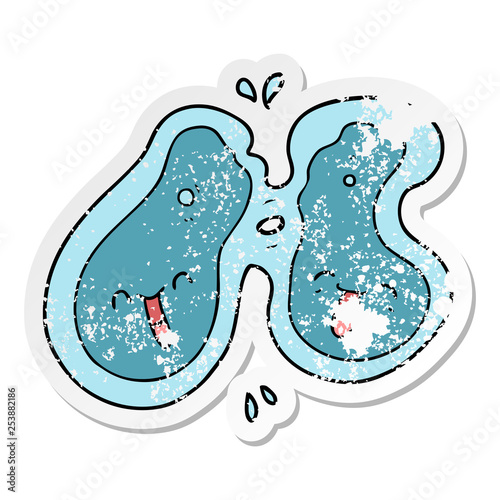 distressed sticker of a cartoon cell dividing