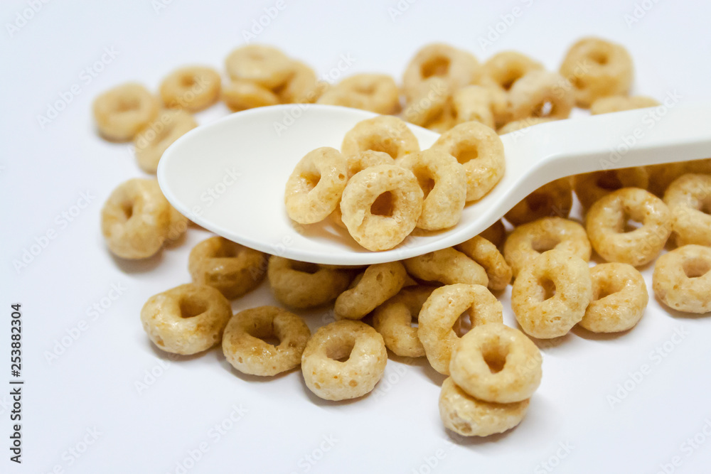 cereal and spoon on white background