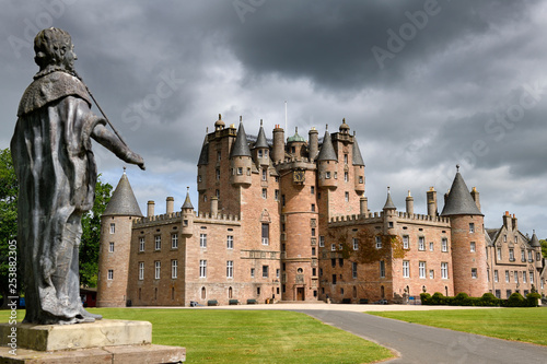 Front lawn of Glamis Castle childhood home of Queen Mother with lead statue of King James I of England and King James VI of Scotland photo