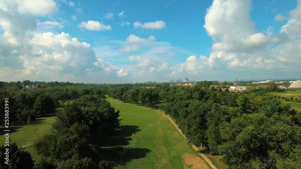 Picturesque aerial of parks and gardens in Louisville, Kentucky with a view if the cityscape in the distance, on a clear sunny day. Picturesque aerial of parks and gardens in Louisville, Kentucky with a view if the cityscape in the distance, on a clear sunny day.