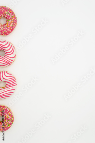 Picture of donuts frosted, pink glazed and sprinkles donuts isolated on white background