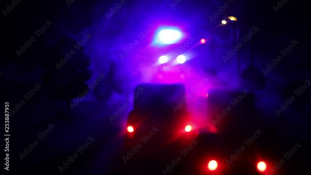 lighting of police car in the night during accident on the road. Artwork table decoration. Selective focus lighting of police car in the night during accident on the road. Artwork table decoration. Selective focus