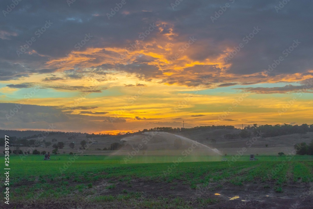 Farm irrigator watering field 