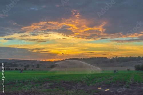 Farm irrigator watering field 