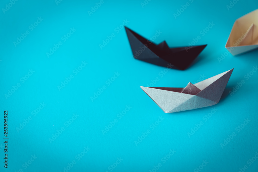 paper boat on bright background with copy space, learning and education concept paper boat on bright background with copy space, learning and education concept