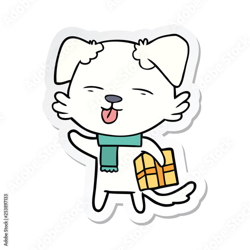 sticker of a cartoon dog with xmas gift