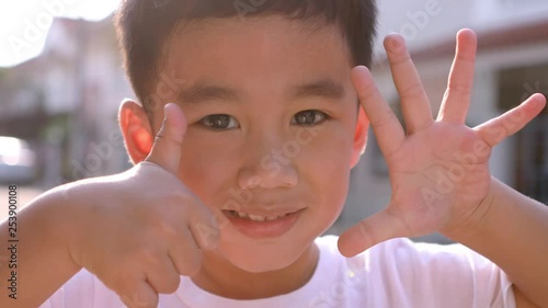 asian children hand sign of counting number