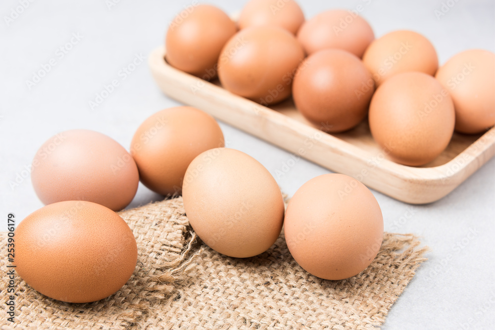 Fresh Eggs (chicken) Close-up with stone white background. Fresh Eggs (chicken) Close-up with stone white background.