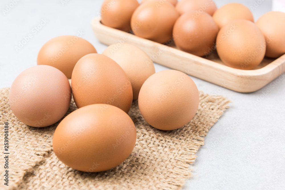 Fresh Eggs (chicken) Close-up with stone white background. Fresh Eggs (chicken) Close-up with stone white background.