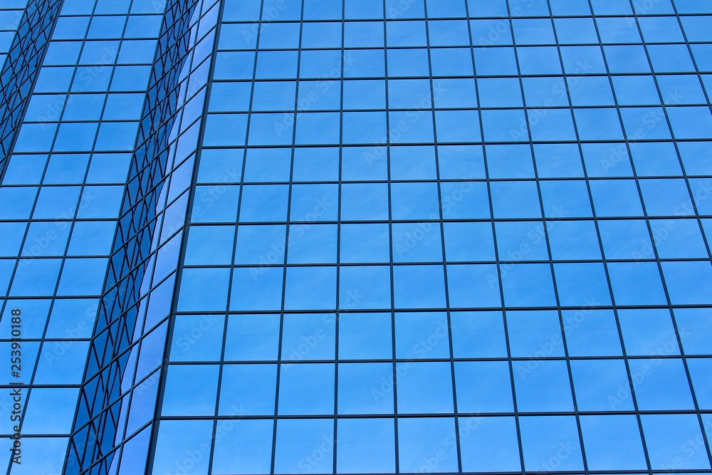 Blue windows reflection on a tall building Blue windows reflection on a tall building