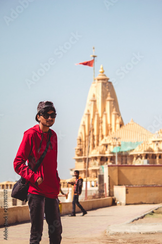 Man standing in front of temple © Shiv Mer