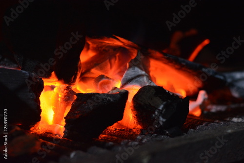 Coals burning. Warm and cozy background.