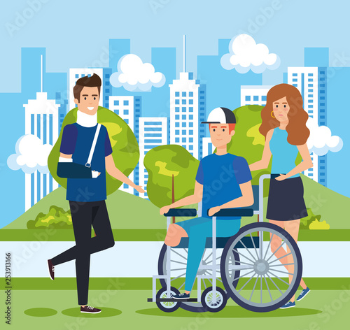 man with hand fracture and other sitting in wheelchair