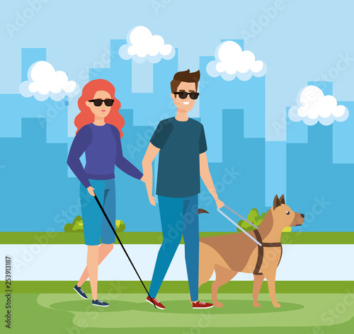 woman and man blind wearing sunglasses and dog