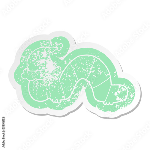 cartoon distressed sticker of a caterpillar obsessing over his regrets wearing santa hat
