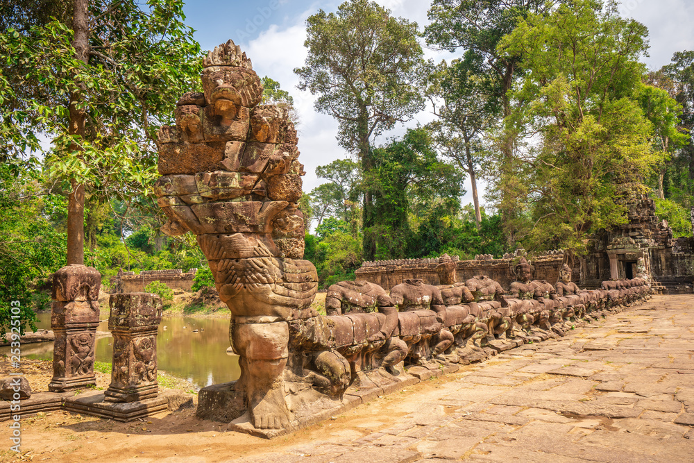 Fototapeta premium Preah Khan temple, Cabodia: Serpent Vasuki head on railings depicting Churning of the sea of milk of khmer mythology