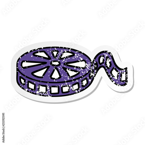distressed sticker of a cute cartoon film reel