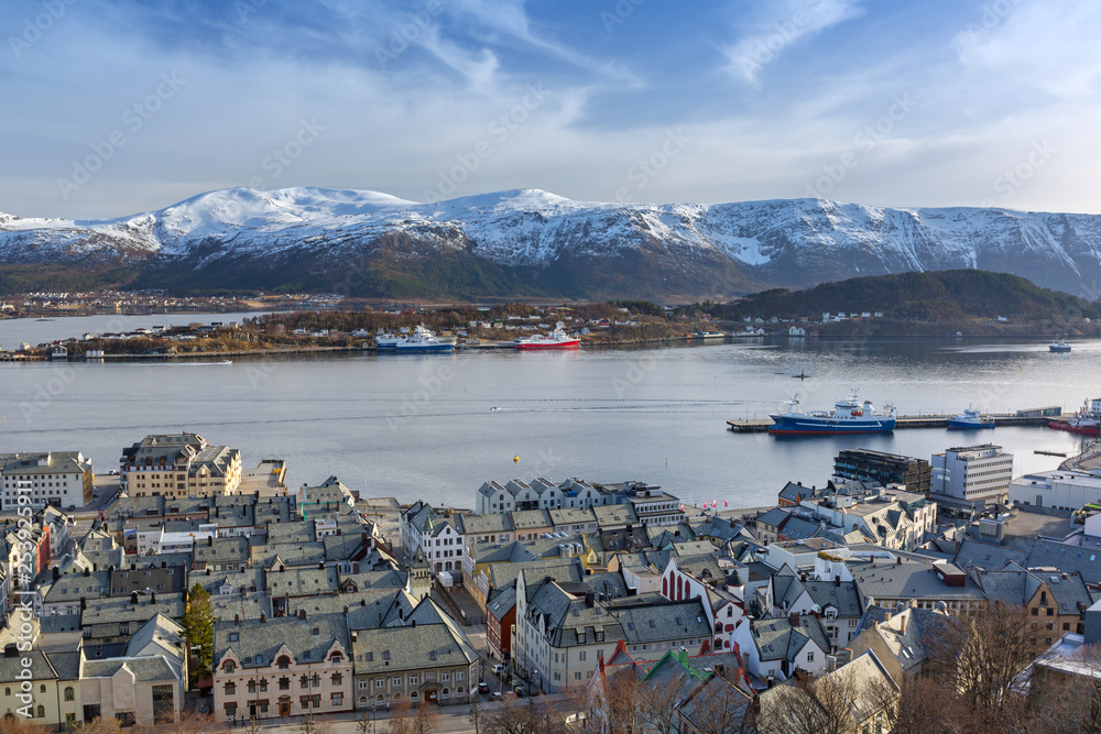 Fototapeta premium Alesund town and snowy mountains in Norway