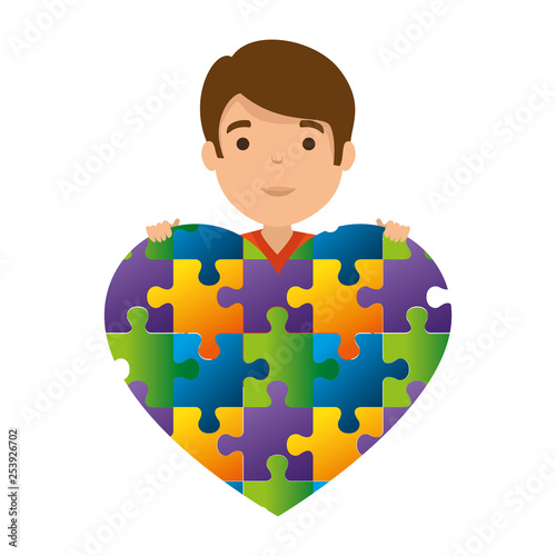 young boy with heart puzzle attached