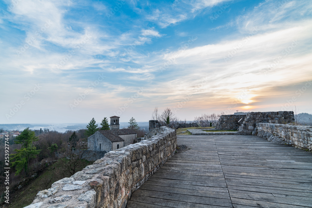 Fototapeta premium Sunset on the ancient castle of Ragogna, Italy. Fortress guarding the ford on the river Tagliamento