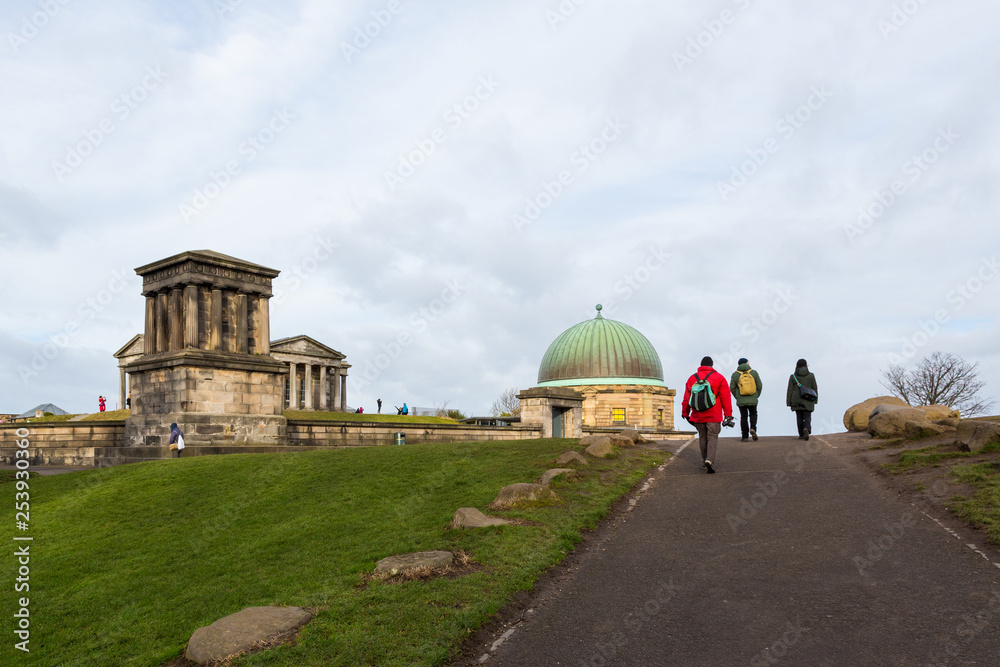 Obraz premium EDINBURGH, SCOTLAND - FEBRUARY 9, 2019 - Calton Hill is at the bottom of Princes Street. On the hilltop are several monuments including the City Observatory