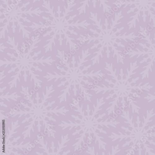 big and small snowflakes on a pink background