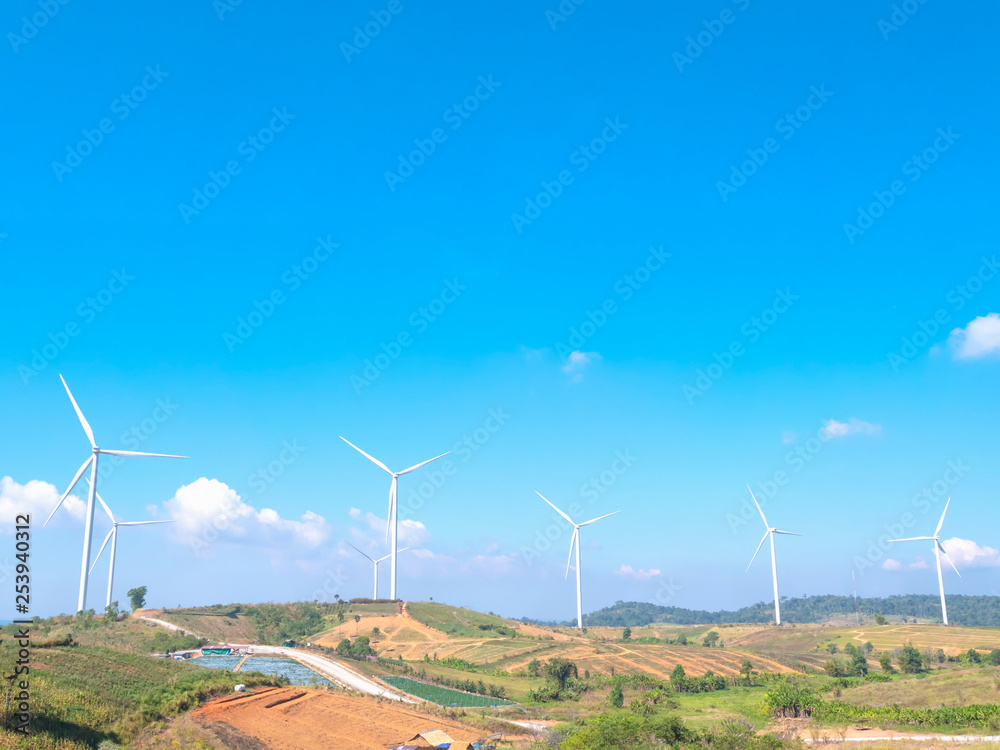 Wind turbines are spinning to generate electricity. Wind turbines are spinning to generate electricity.