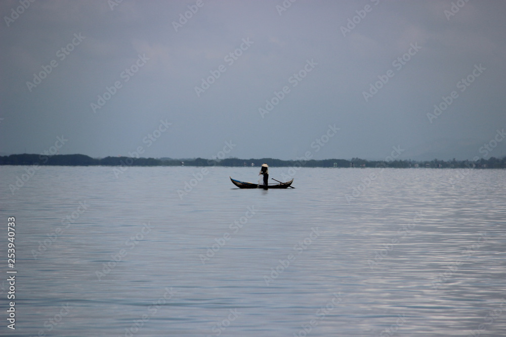 fisherman on the lake