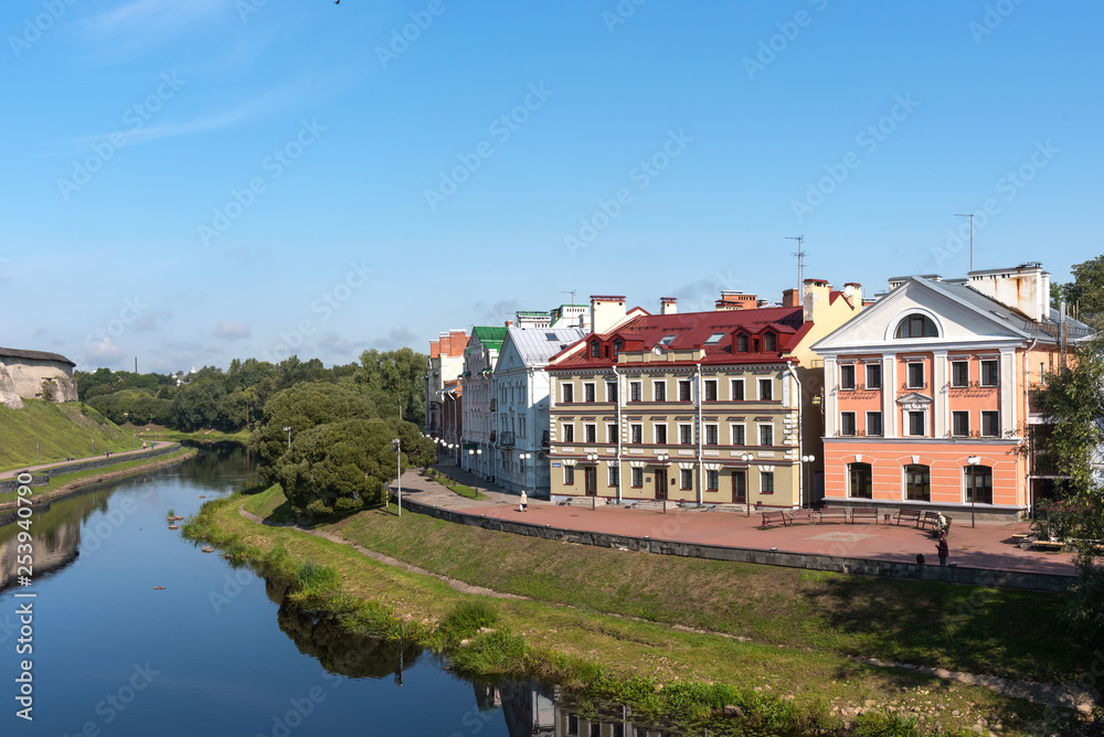 The Golden Embankment on the Velikaya River on a sunny summer day. Pskov. Russia
