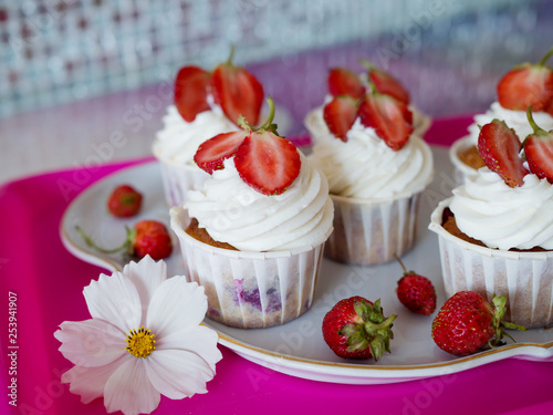 Homemade Beautiful Cupcakes with Ripe Red Strawberries