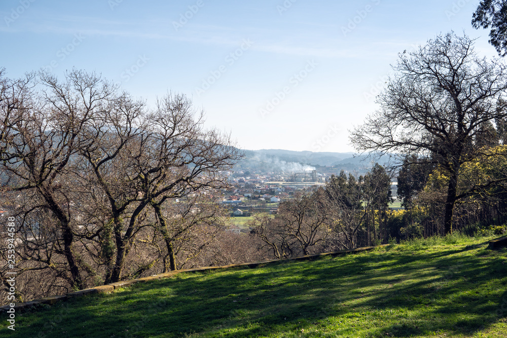 View of a Factory emitting smoke polluting the atmosphere. Pollution concept