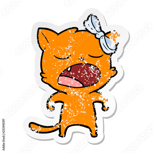 distressed sticker of a cartoon yawning cat