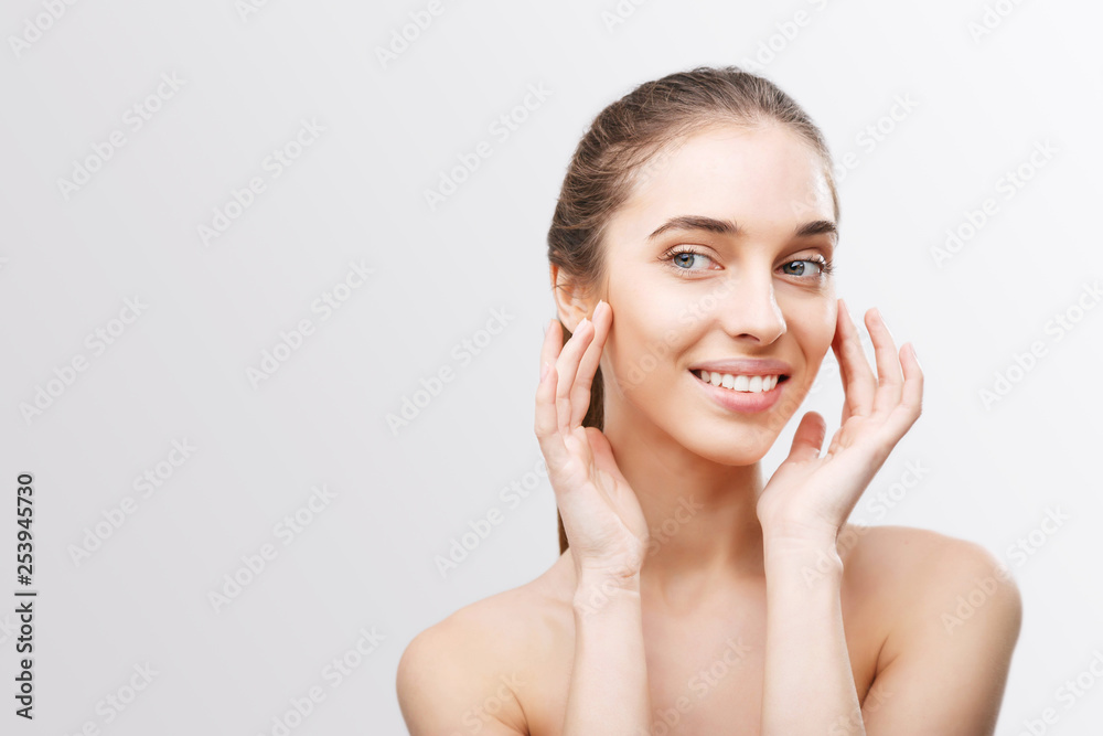 Beauty portrait of woman applying moisturizing mask or creme on face Beauty portrait of woman applying moisturizing mask or creme on face