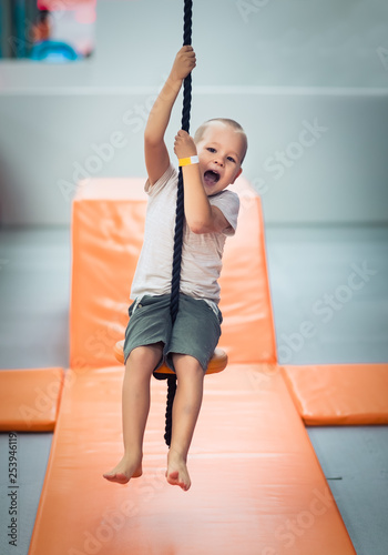 Cute kid boy at playground photo