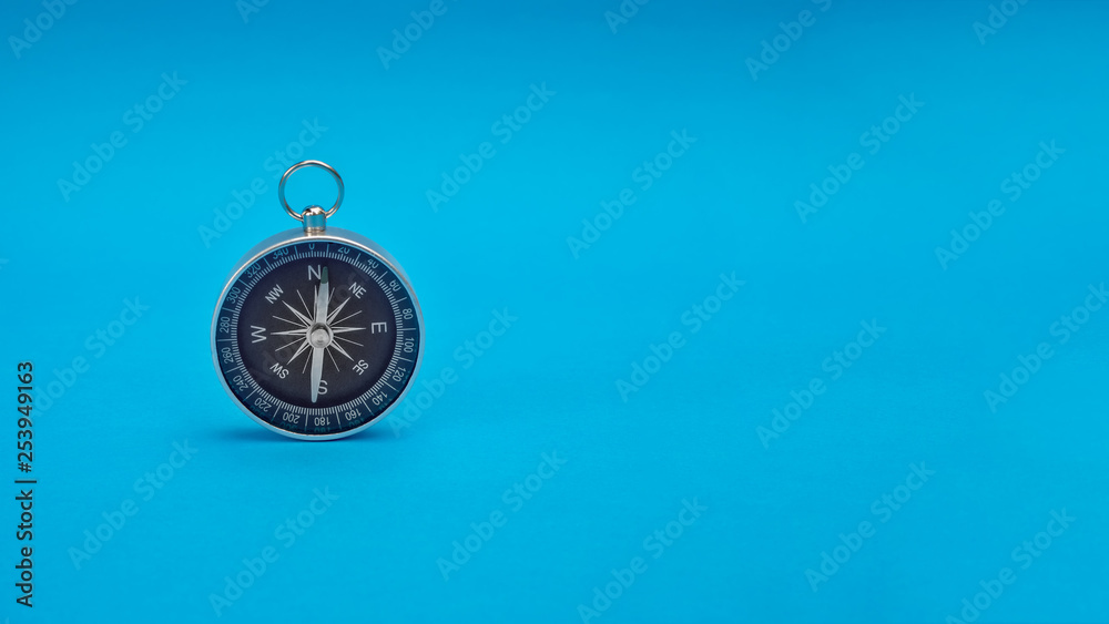 compass on blue background