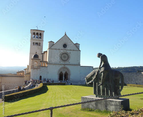 Basilica of Saint Francis of Assisi with the bronze statue of the Saint in the foreground.