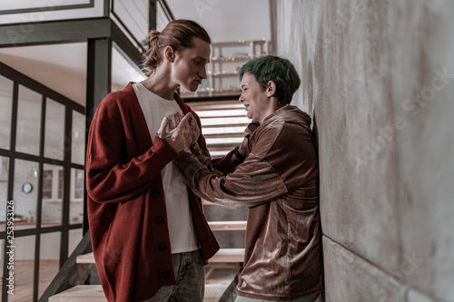 Green-haired girlfriend begging boyfriend not to beat her photo