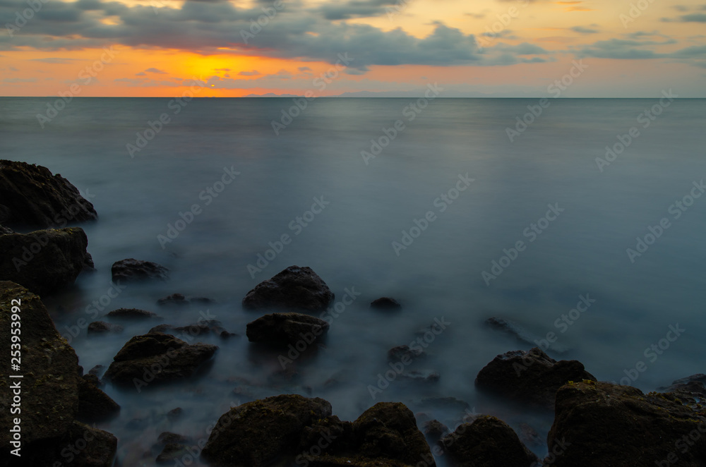 Beautiful sunset of the beach with rocks. Beautiful sunset of the beach with rocks.