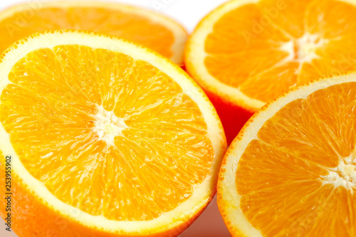 slices of fresh orange on white background