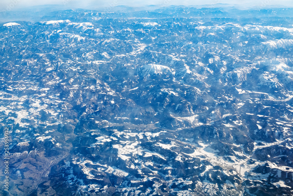 above view of Alps with valley from airplane