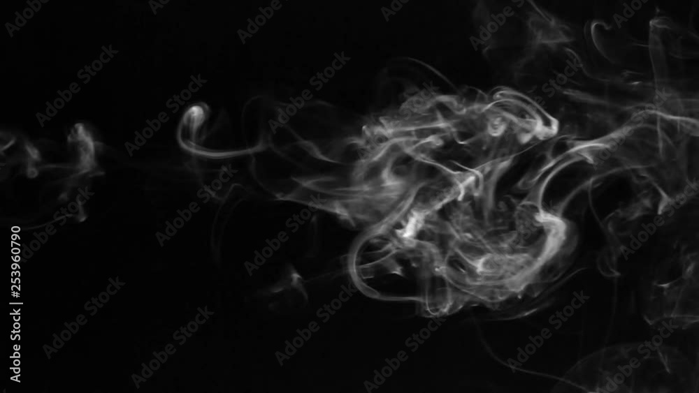 Twists of white smoke on a black background.