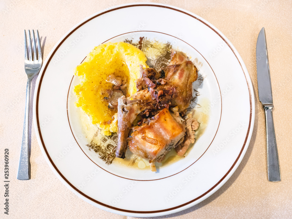 Italian cuisine - top view of Rabbit with Polenta Italian cuisine - top view of Rabbit with Polenta