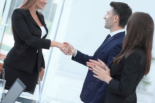 close up. handshake of financial partners at the negotiating table