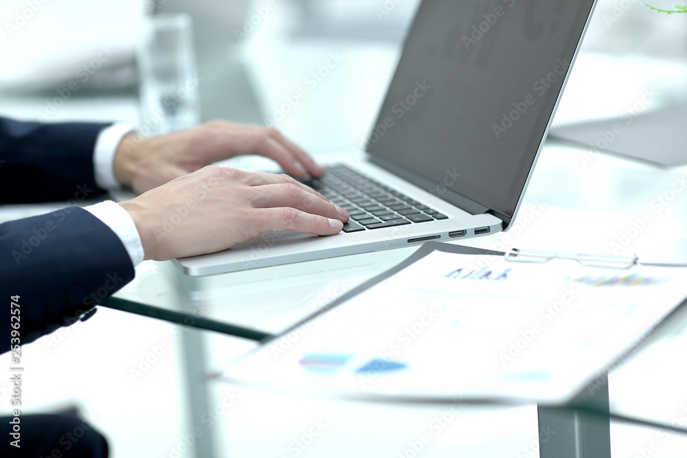 close up.businessman working with financial charts on laptop close up.businessman working with financial charts on laptop
