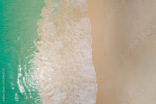 Aerial top view beautiful sea landscape, beach and wave with turquoise sea water with copy space