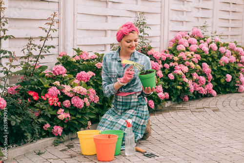 hydrangea. Spring and summer. Greenhouse flowers. woman care of flowers in garden. happy woman gardener with flowers. Flower care and watering. soils and fertilizers. Like what you do