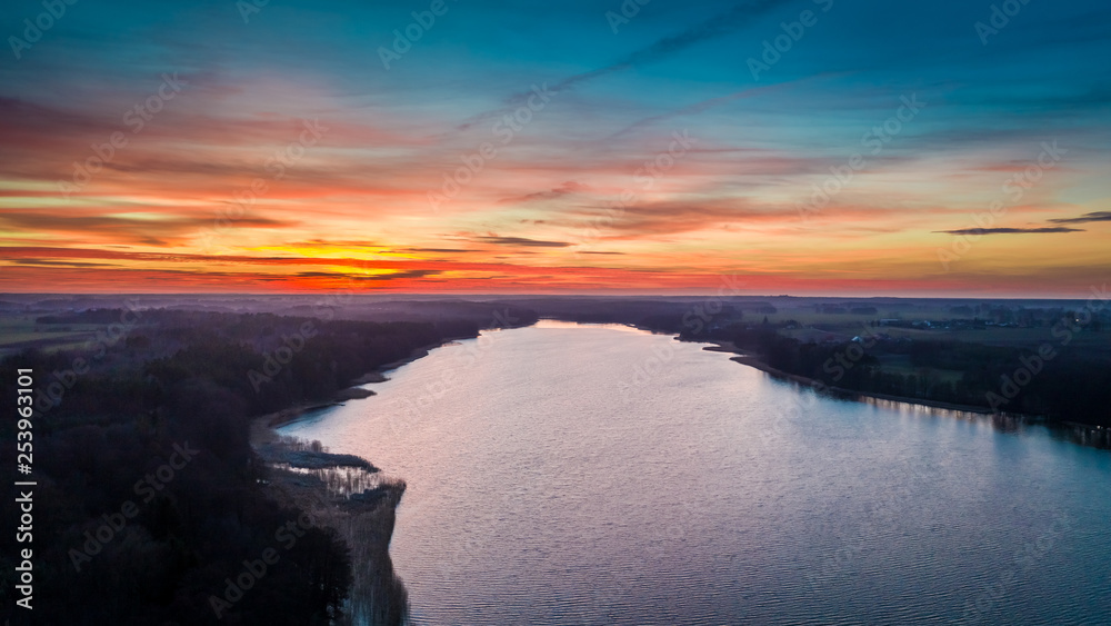 Obraz premium Aerial view of melting ice on lake at dusk